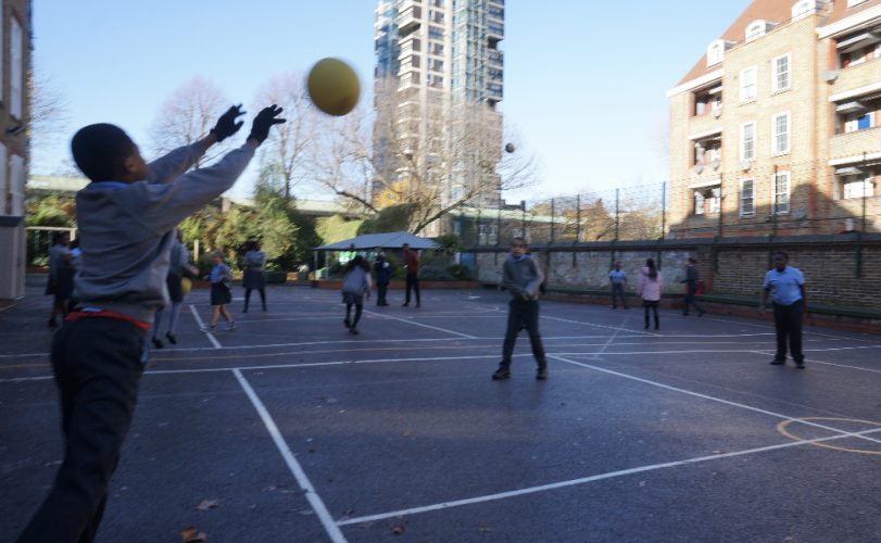 Children play volleyball, on School playground