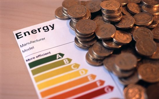 image of an appliance energy efficience rating label and a pile of uk pennies