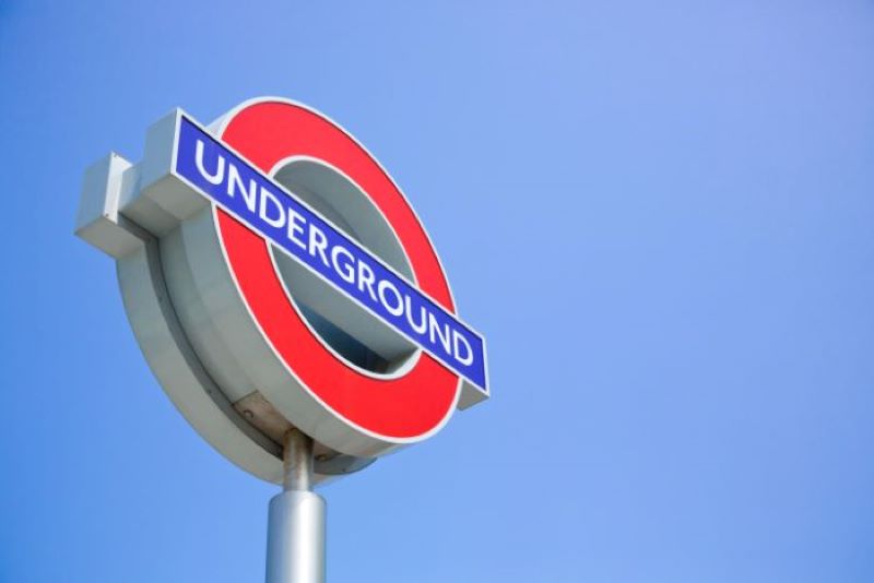 london underground sign on a post