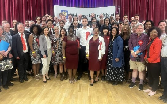 Lewisham's Labour councillors gather on stage all looking at the camera