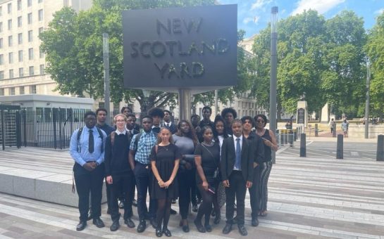 A group of students stood outside the Met Police HQ