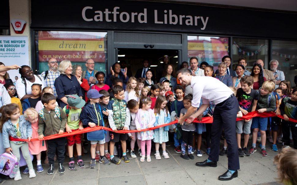 Lewisham mayor Damien Egan cuts the red ribbon to open Catford's new library