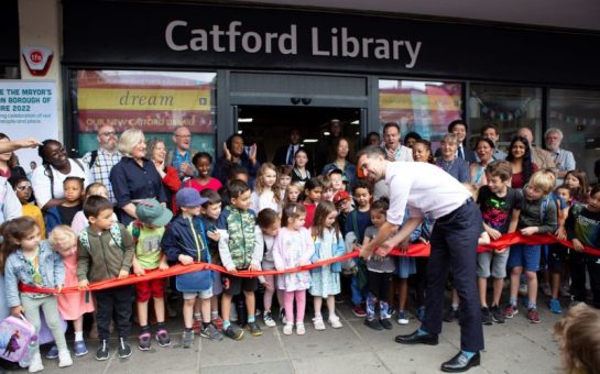 Lewisham mayor Damien Egan cuts the red ribbon to open Catford's new library