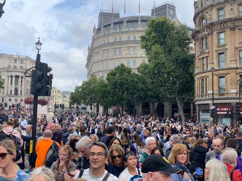 Crowds gather to catch a glimpse of the Queen's coffin