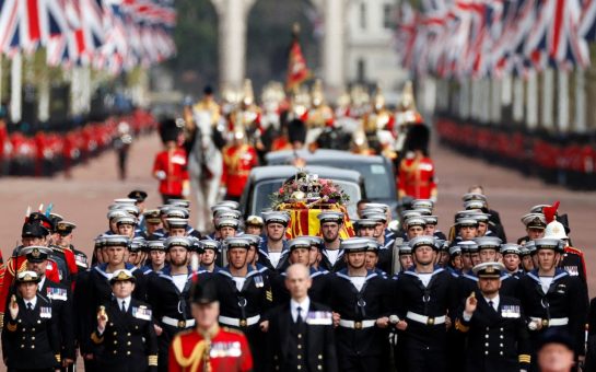 The Queen's coffin travels down The Mall