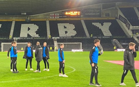 Torquay players walking around the ground