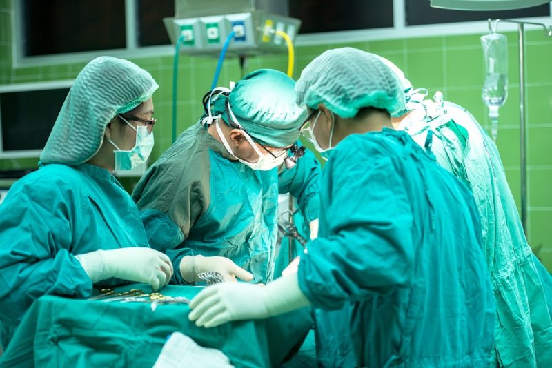 Doctors performing surgery in an operating theatre