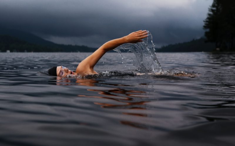 Woman swimming in lake