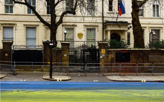 Giant Ukraine flag painted by protesters outside Russian embassy in London