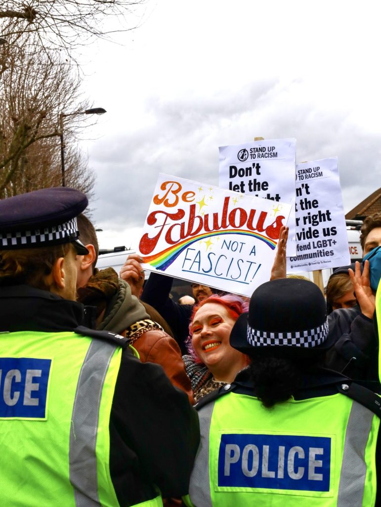 Protester holds placard in solidarity 