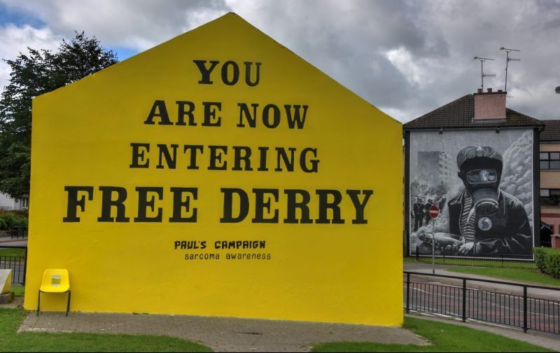 The Free Derry mural - an icon of the 'Troubles' - is repainted to reflect Norther Ireland's modern problems - a campaign to promote awareness for sarcoma cancer.