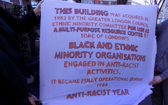 Banner with the text on the plaque outside the 5 Westminster Bridge Road Community Centre in Southwark, held by the Reop Centre squatters outside Clerkenwell and Shoreditch County Court