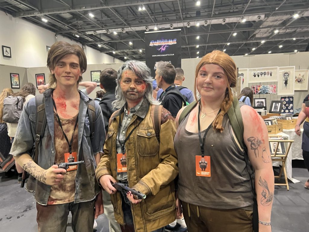 Cosplayers dressed as characters from The Last of Us pose at London Comic Con