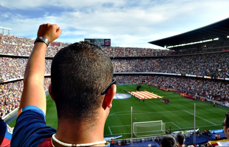 A man supporting his team in a football match