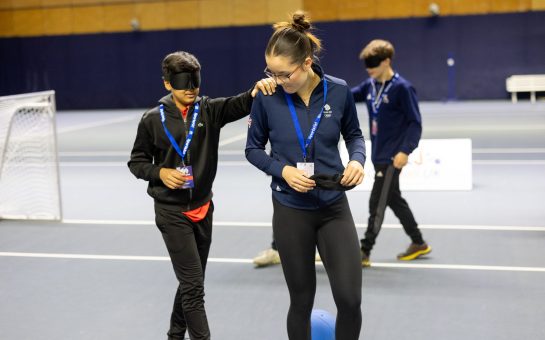 Amelie Tsang at SportsAid workshop leading another blindfolded athlete