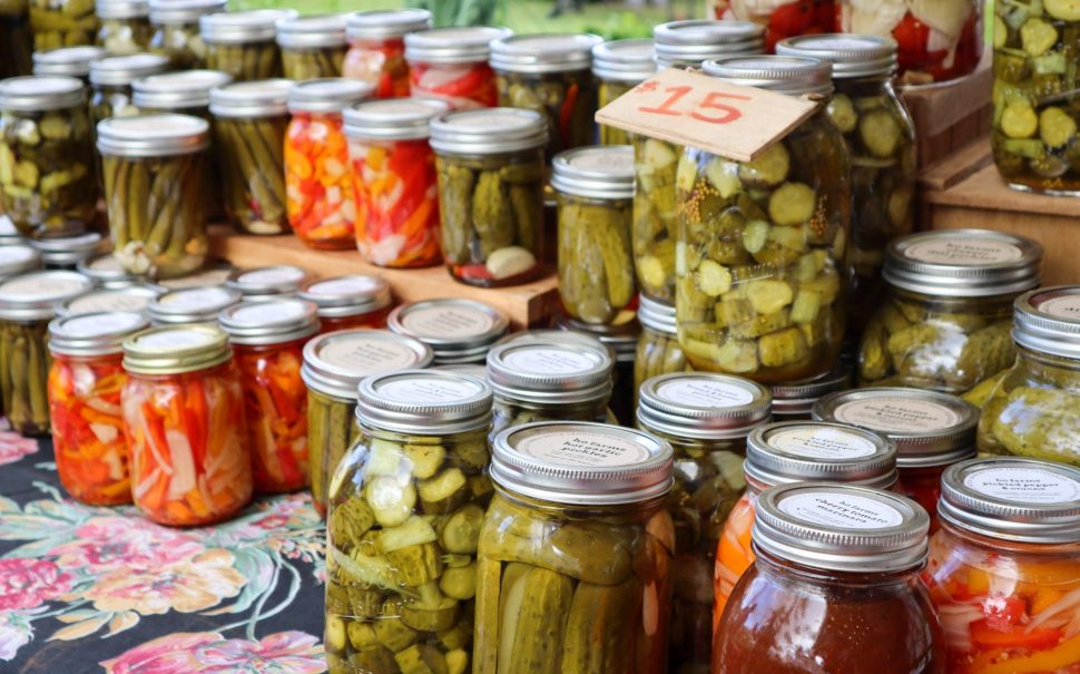 Photo of jars full of pickles of different varieties