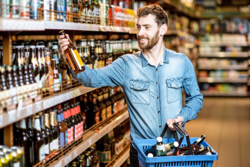 Person holding a bottle of alcohol free beer