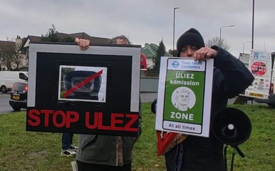 Two protestors protesting about ULEZ cameras