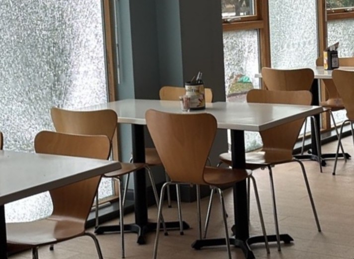 A picture of the broken windows at the cafe