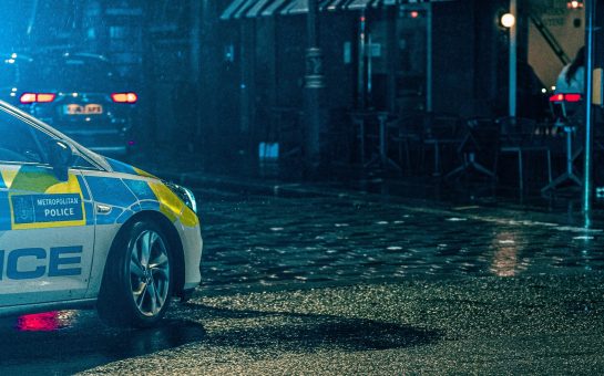 A Metropolitan Police car at night.