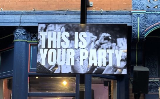 TV screen at a bar showing 'This is Your Party'