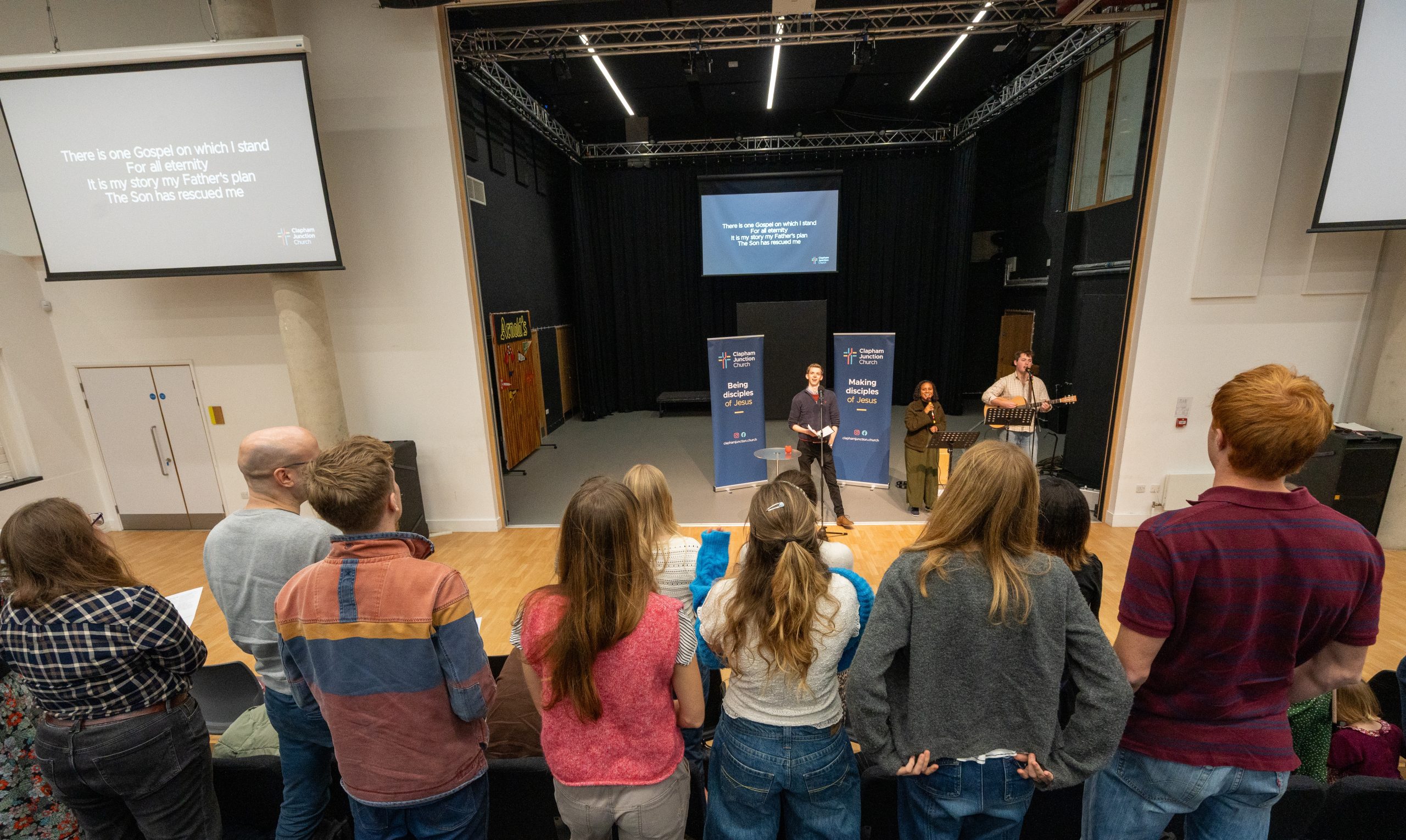 Congregation sing and worship at church.