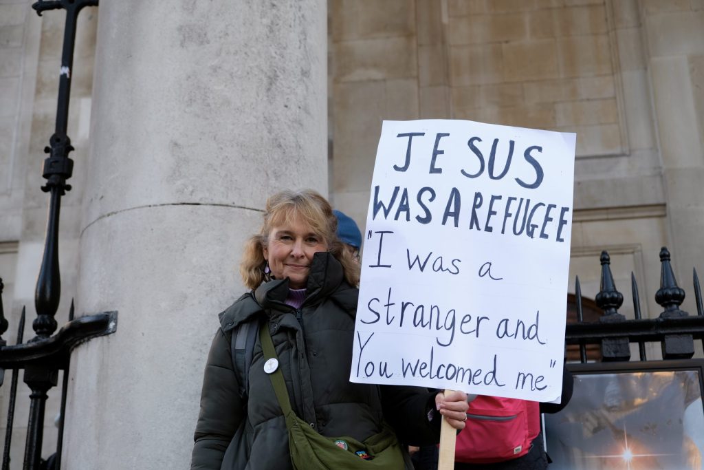 People gathered on Trafalgar Square holding banners with messages of support for migrant communities. Credit: Hamish McCorriston