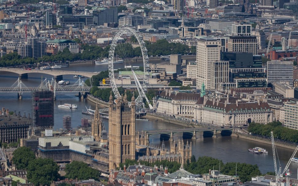 Image of London from above featuring the London Eye and River Thames.
