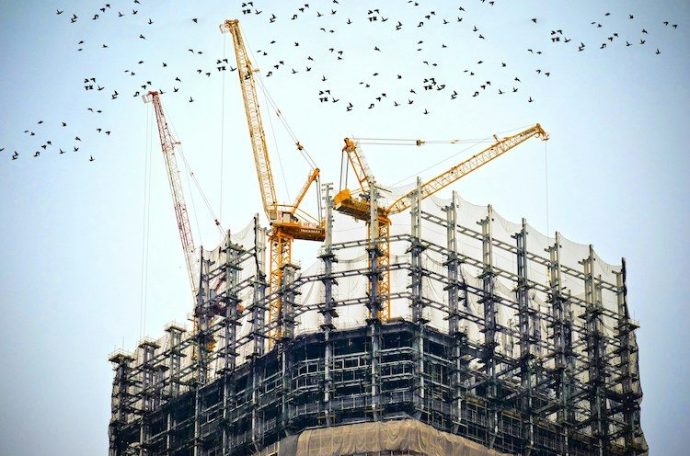Construction site with cranes (Credit: Free to use from Unsplash/Danist Soh)