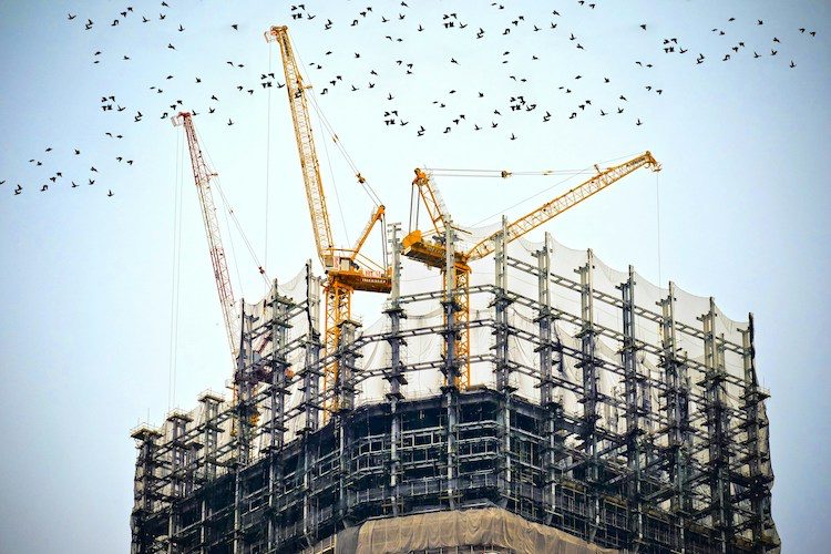 Construction site with cranes (Credit: Free to use from Unsplash/Danist Soh)