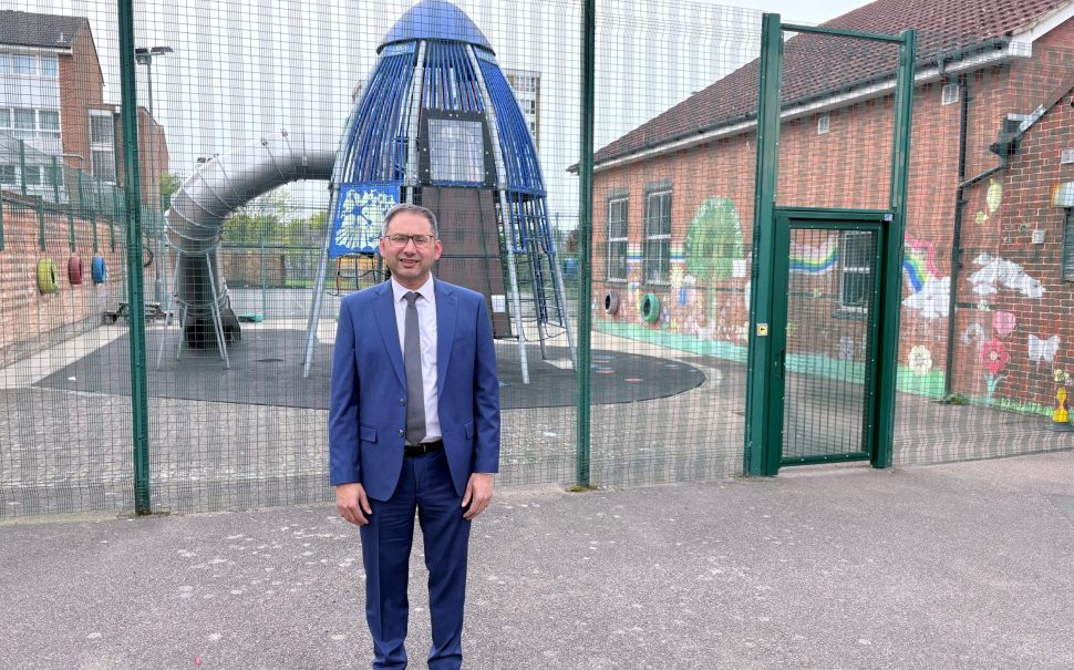 man standing outside play centre