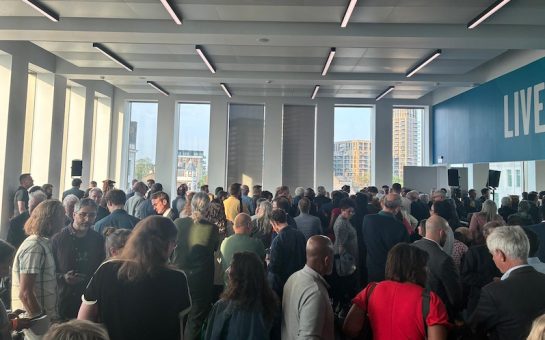 busy announcement hall at Greenwich local election 2026