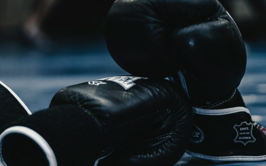 A pair of black boxing gloves