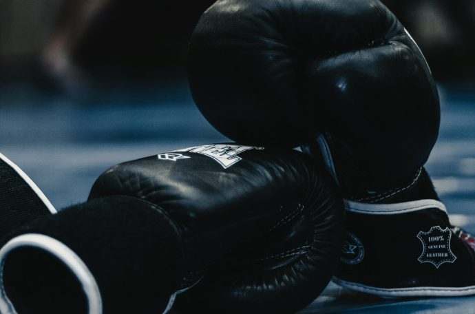 A pair of black boxing gloves