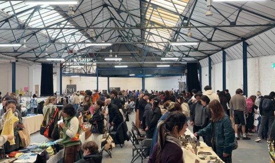 Root Market taking place with a packed crowd browsing the traders on show.