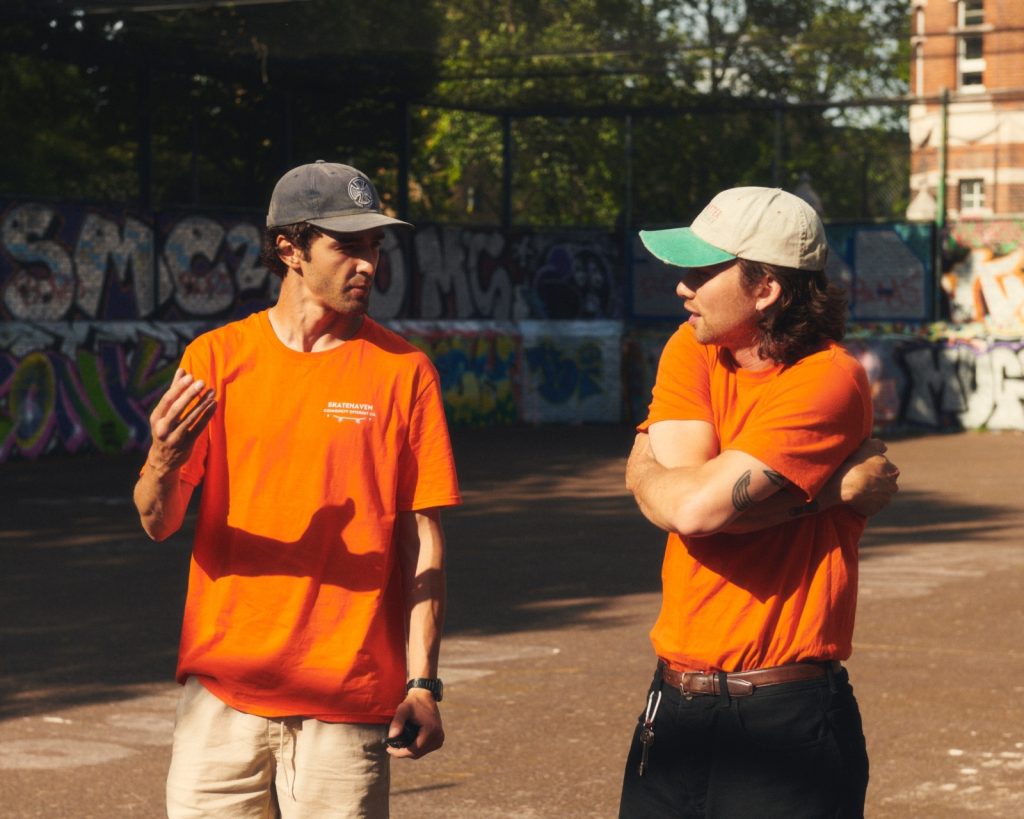 Founders of Skate Haven, Miguel Nyberg and Ricardo Whyte, in conversation with each other at a skate park 