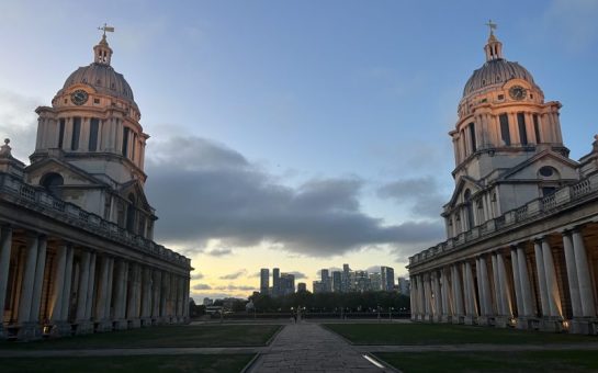 Image of the University of Greenwich's main campus, two towers photographed at sunset