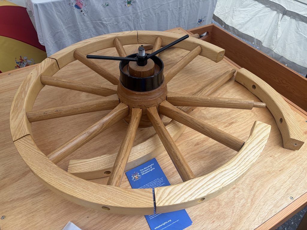 Traditional English-pattern wooden wheel displayed at the Woolmen's Livery Fair