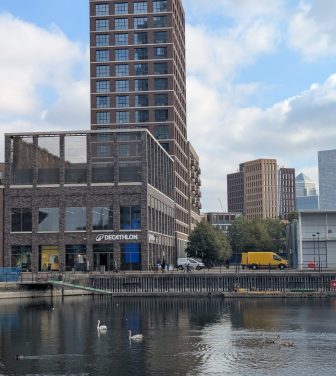 The exterior of Decathlon Surrey Quays, taken from the footbridge over the dock