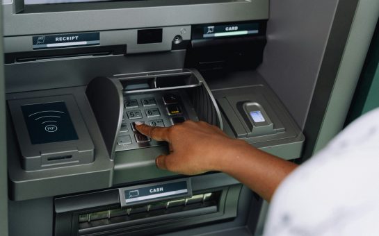 Costumer using an ATM Machine
